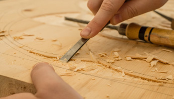 RecruitEasy Carpenters Required shown with an image of a Carpenter on site using power tools wearing a visor